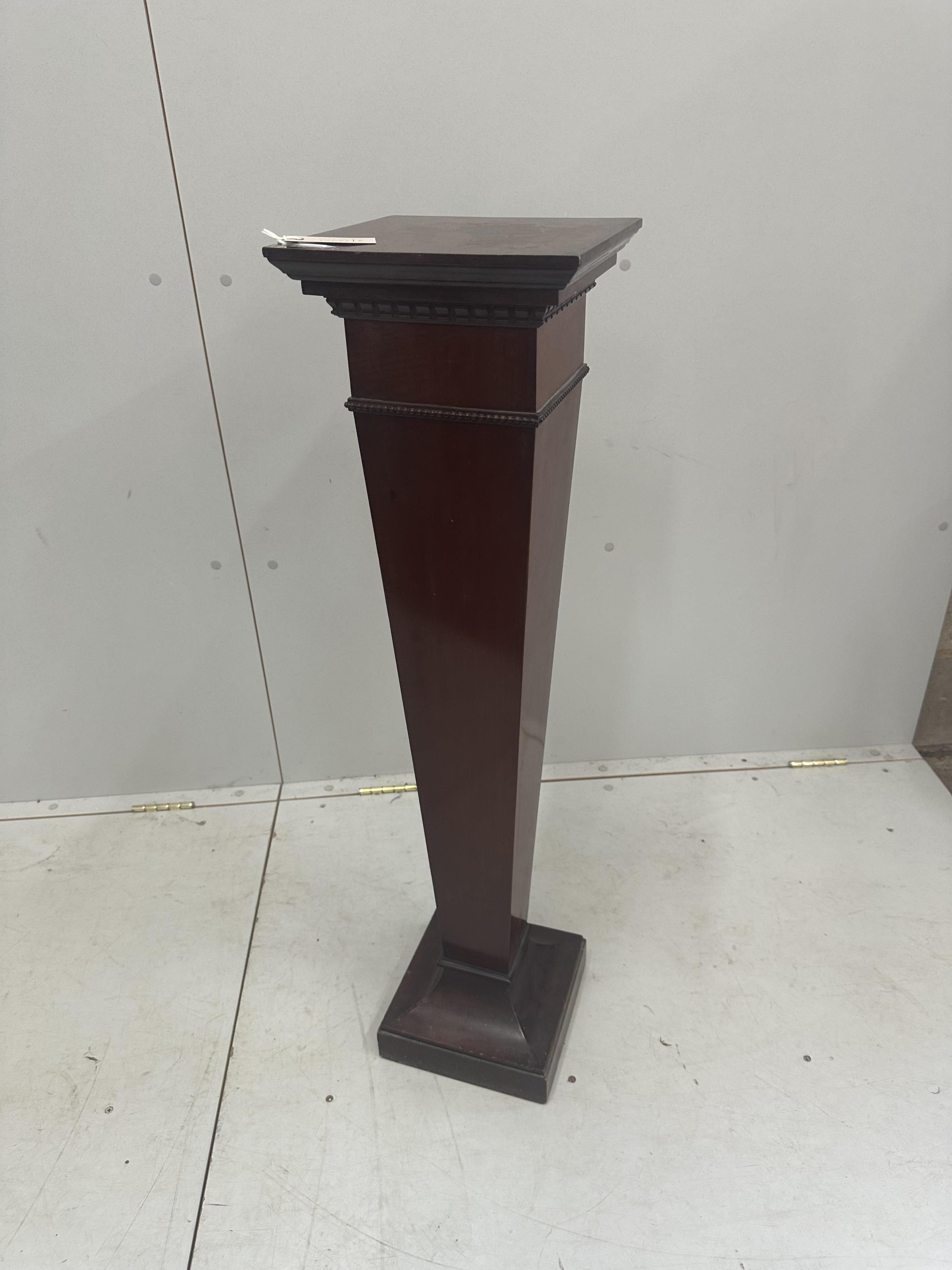 An Edwardian mahogany pedestal, height 99cm. Condition - fair